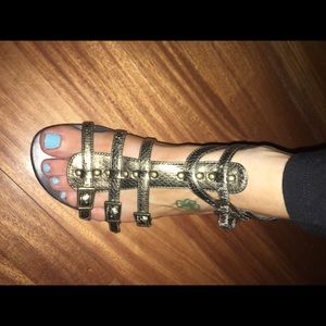 Coppery gladiator sandals size 6.5 but run big