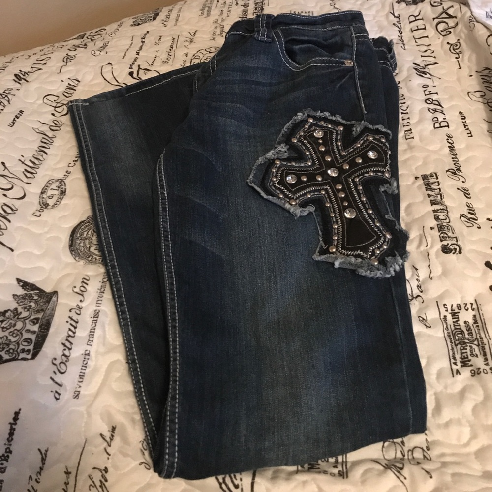 Premiere jeans with a cross