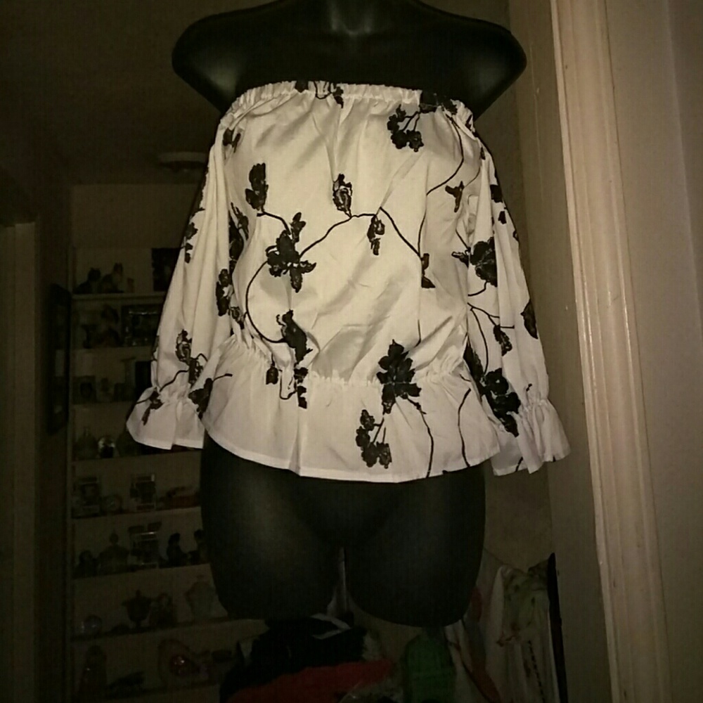 White off the shoulder with a black floral pattern