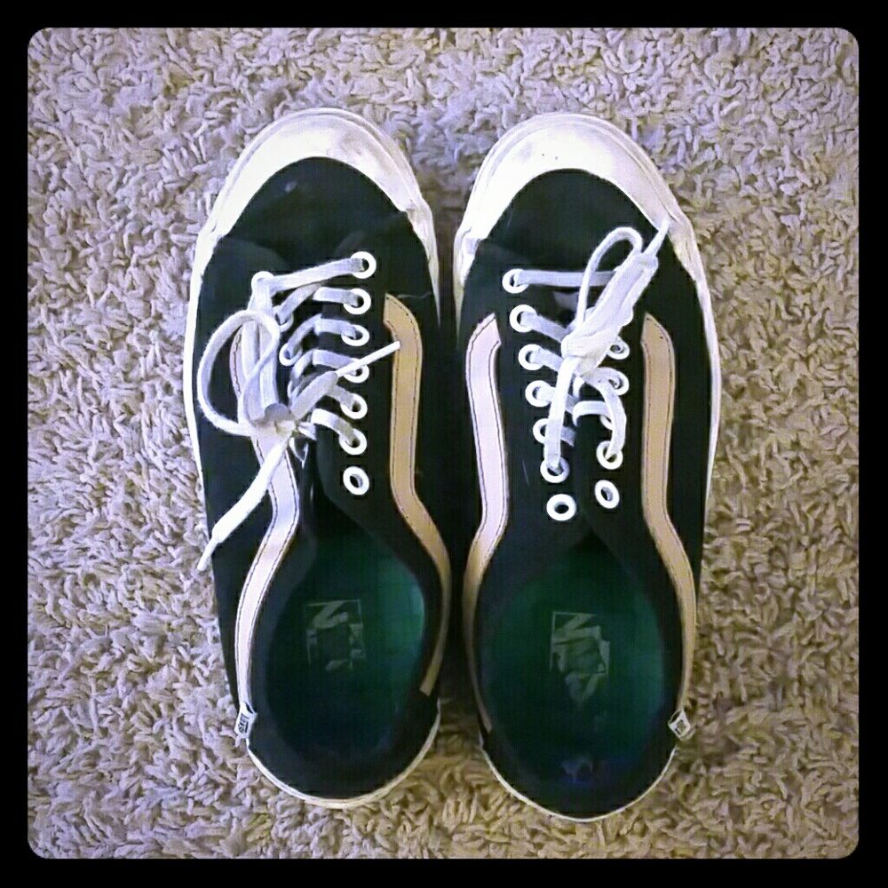 Vans black and tan shoes.