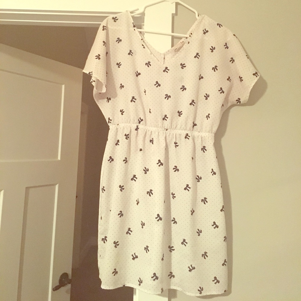 Baby doll dress with bow; size L.