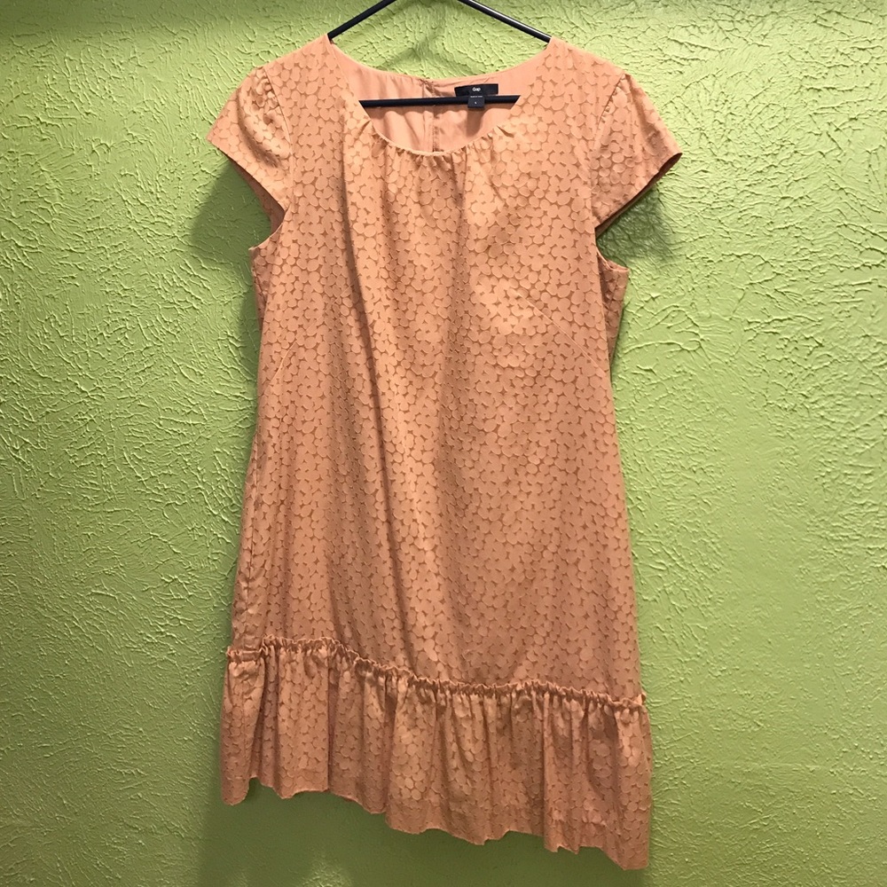 Blush colored GAP dress with ruffled bottom.