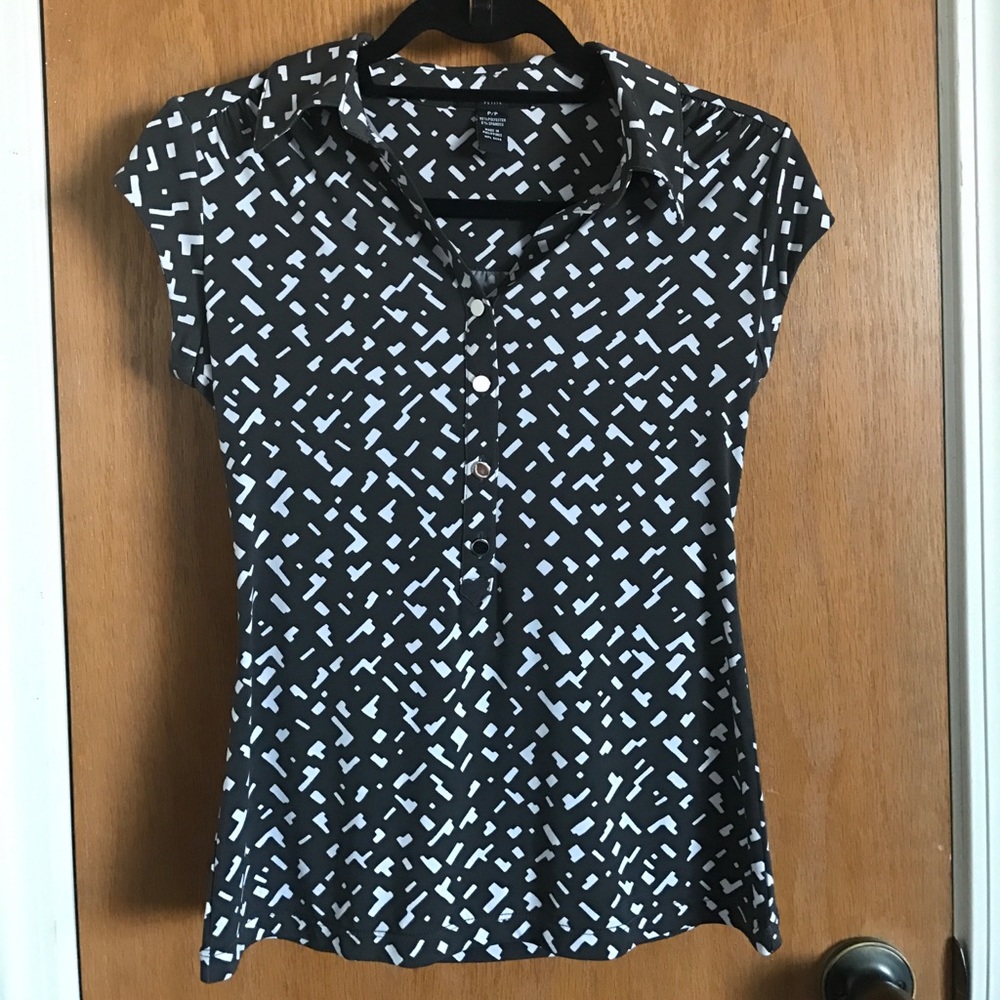 Gray and white blouse with silver buttons.