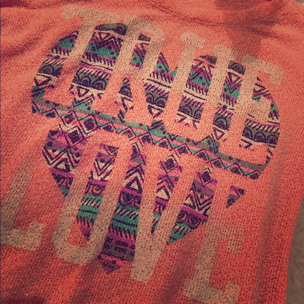 Salmon pink top with graphic design