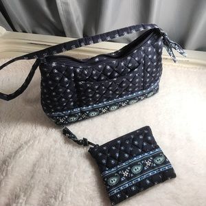 Vera Bradley navy hand bag with matching wallet.