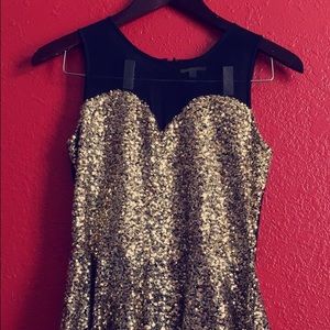 Peplum gold glittery top