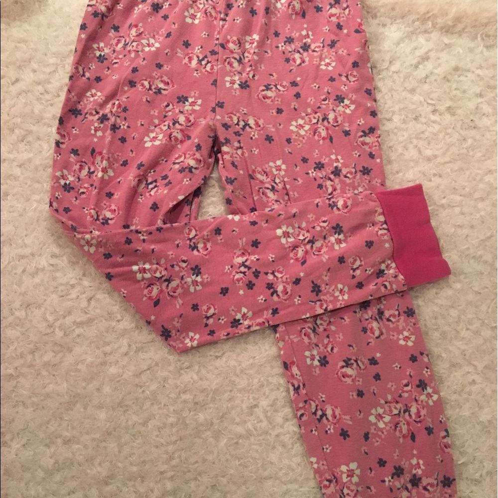 Pink stretchy pjs with floral print