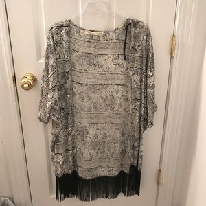 Ross's black and white sweater/cardigan