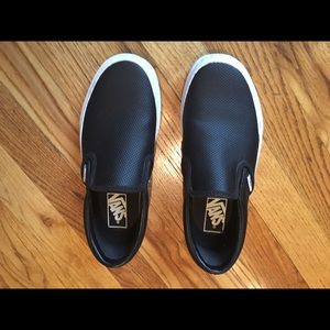 Vans black leather slip ons
