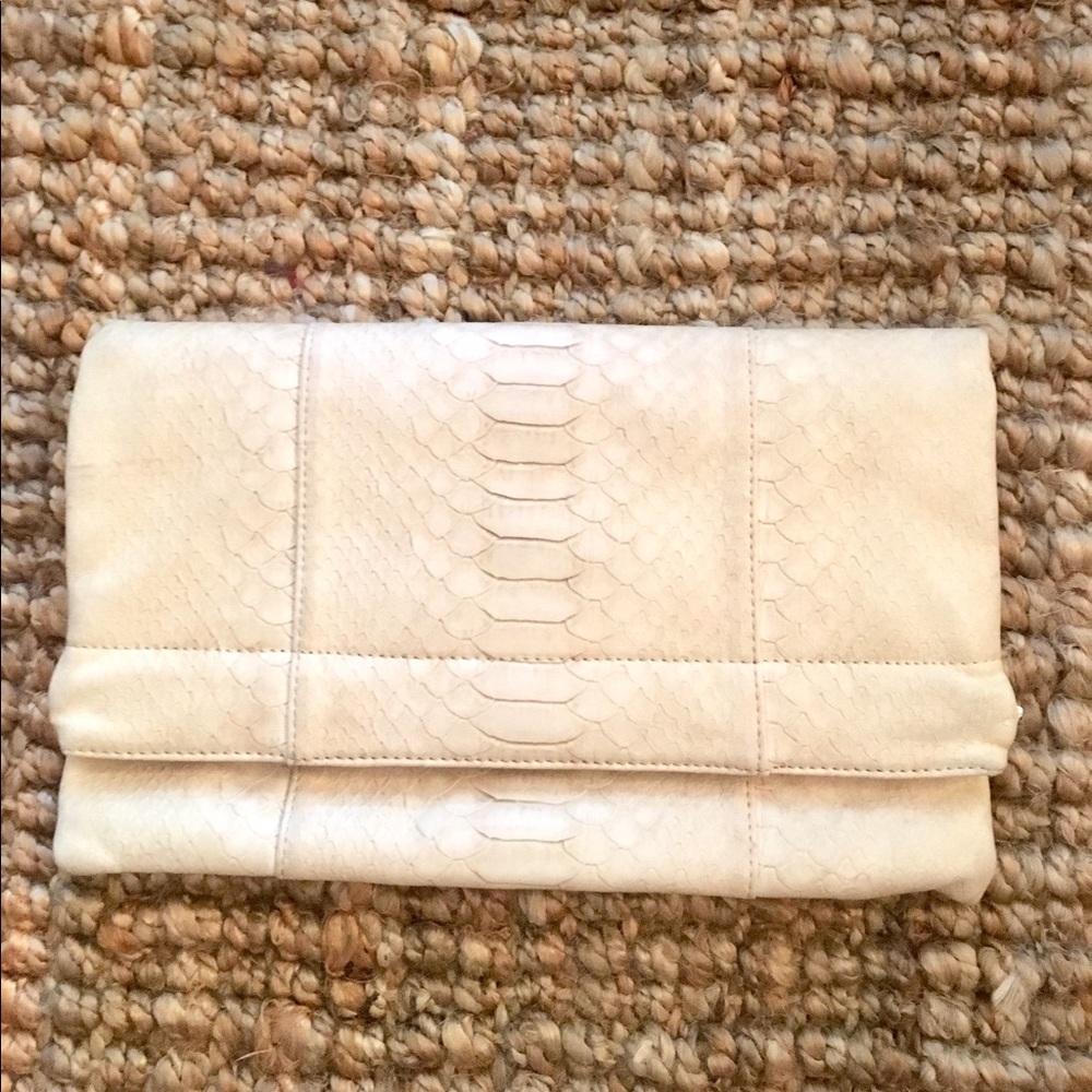 Embossed cream fold over clutch