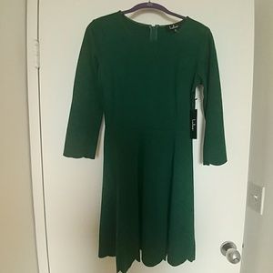 Dark green scalloped dress