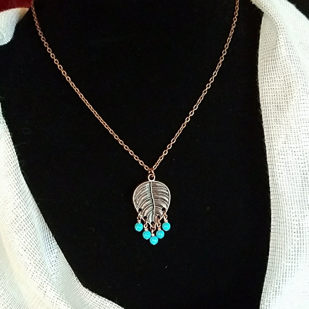 Leaf necklace with chalk turquoise beads.
