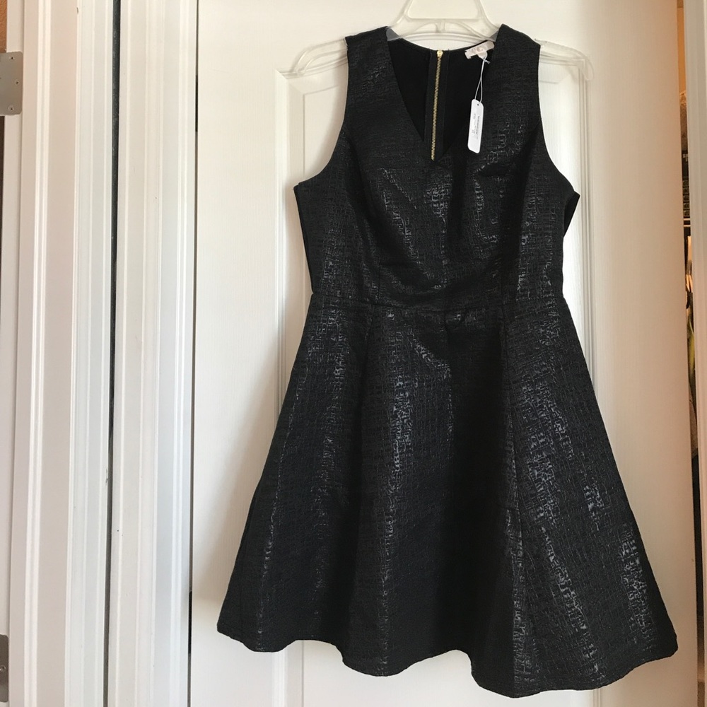 Black cocktail dress with gold detail zipper