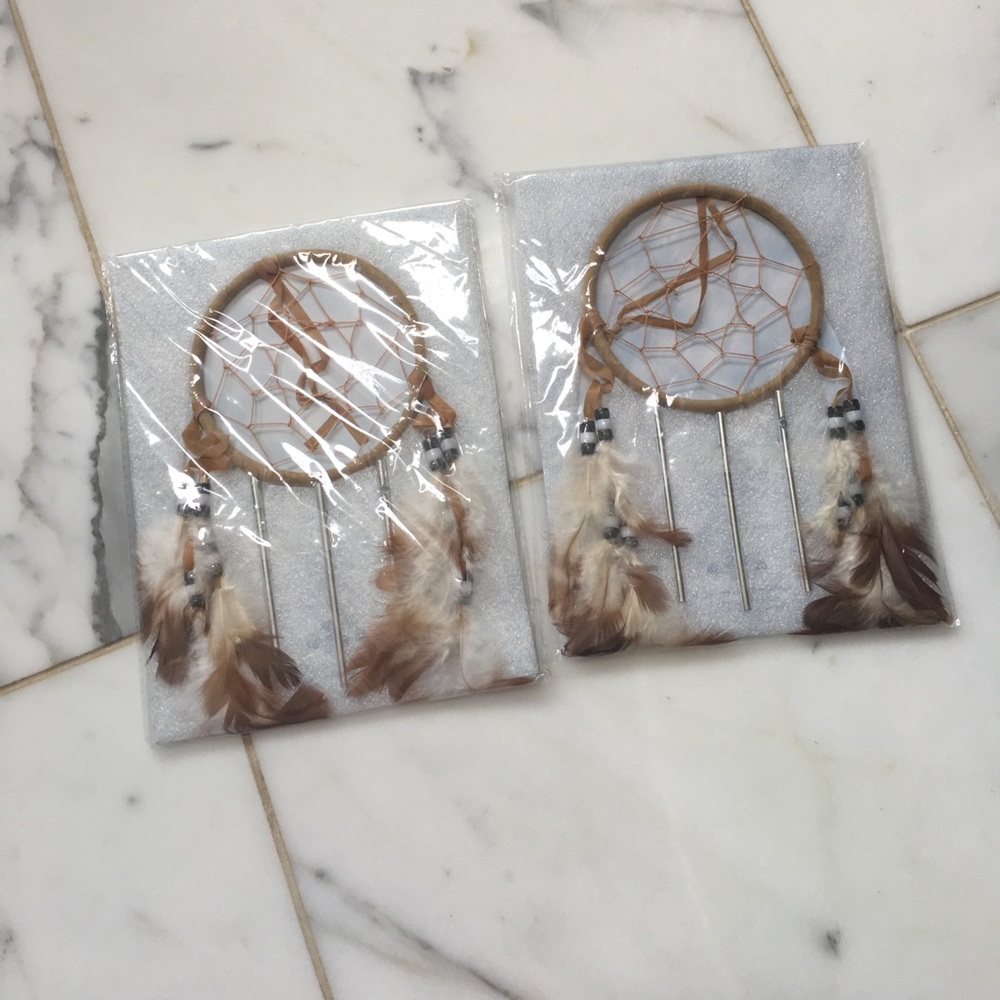 2 Dream Catcher with feathers hanging.