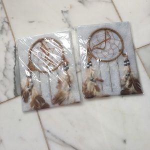 2 Dream Catcher with feathers hanging.