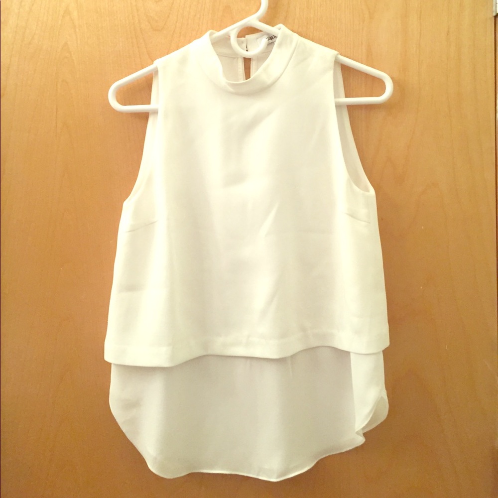 White sleeveless blouse.