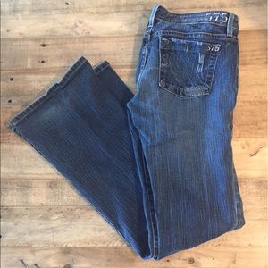 575 Flare distressed denim