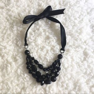 Black head and ribbon necklace