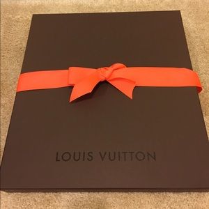 Louis Vuitton box and shopping bag.