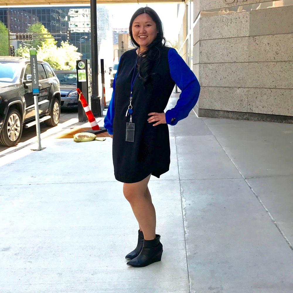 Black dress with blue sleeves.