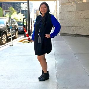 Black dress with blue sleeves.