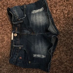 Slight distressed denim shorts.