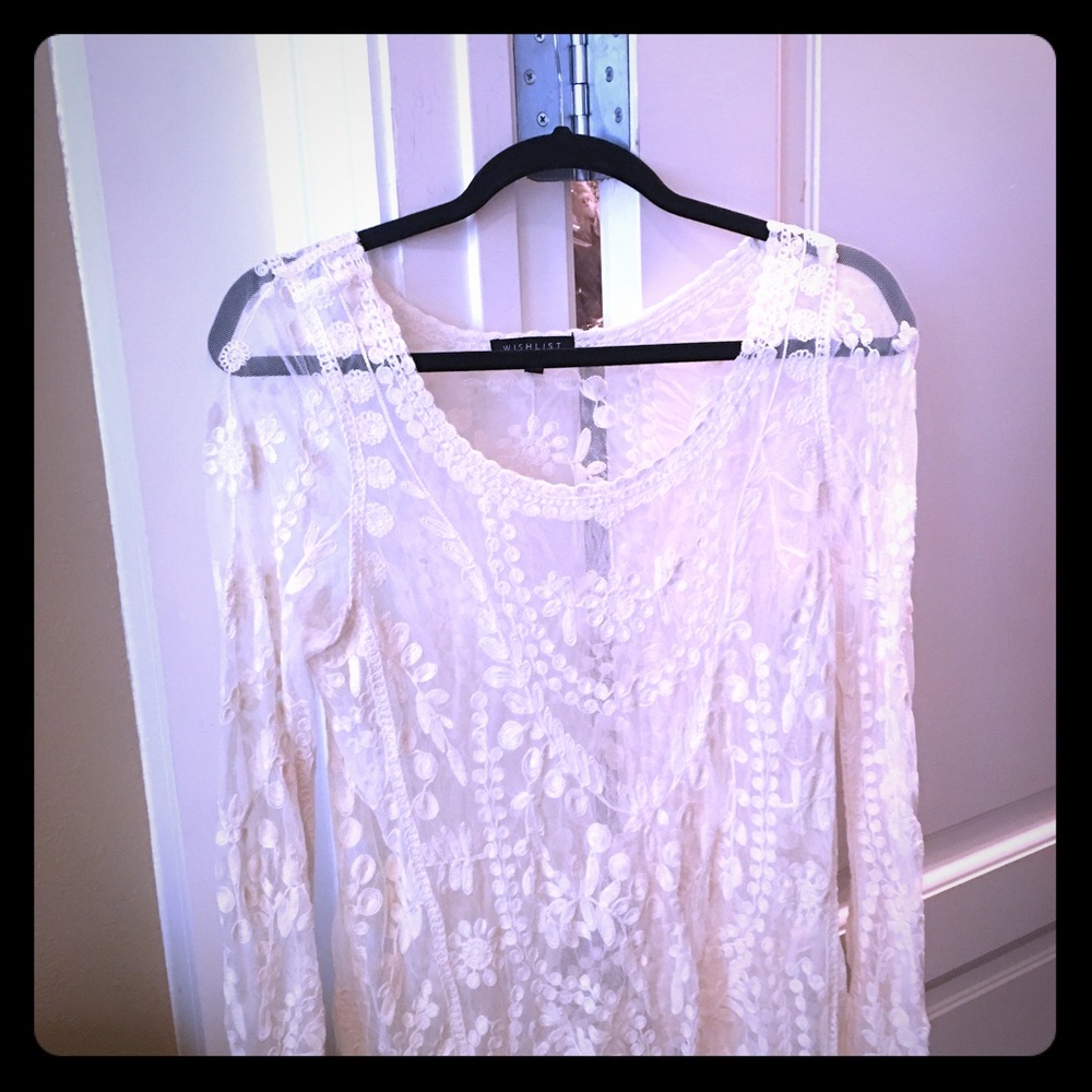 Ladies white lace long sleeve sheer blouse.