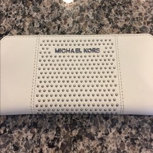 Michael Kors white studded wallet.
