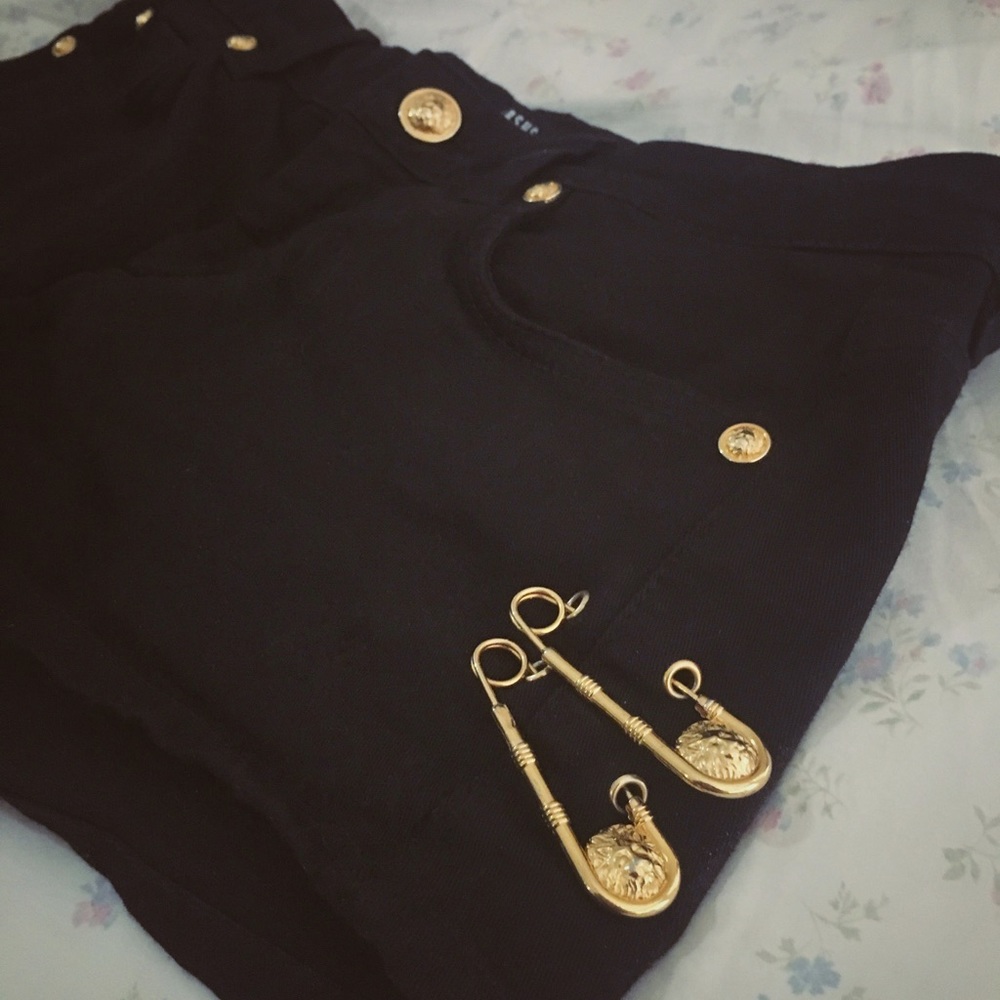 VERSACE black shorts with metal pin and brand logo