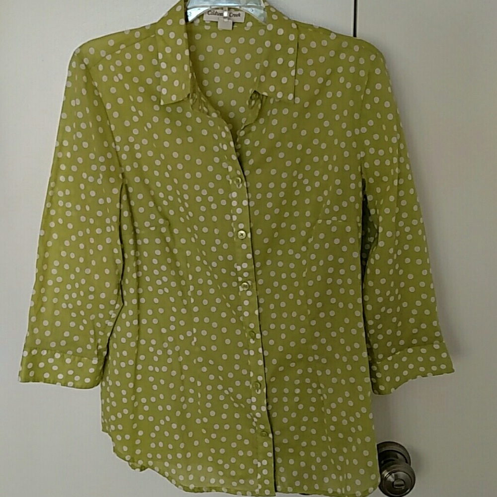 Green polka dot summer shirt.