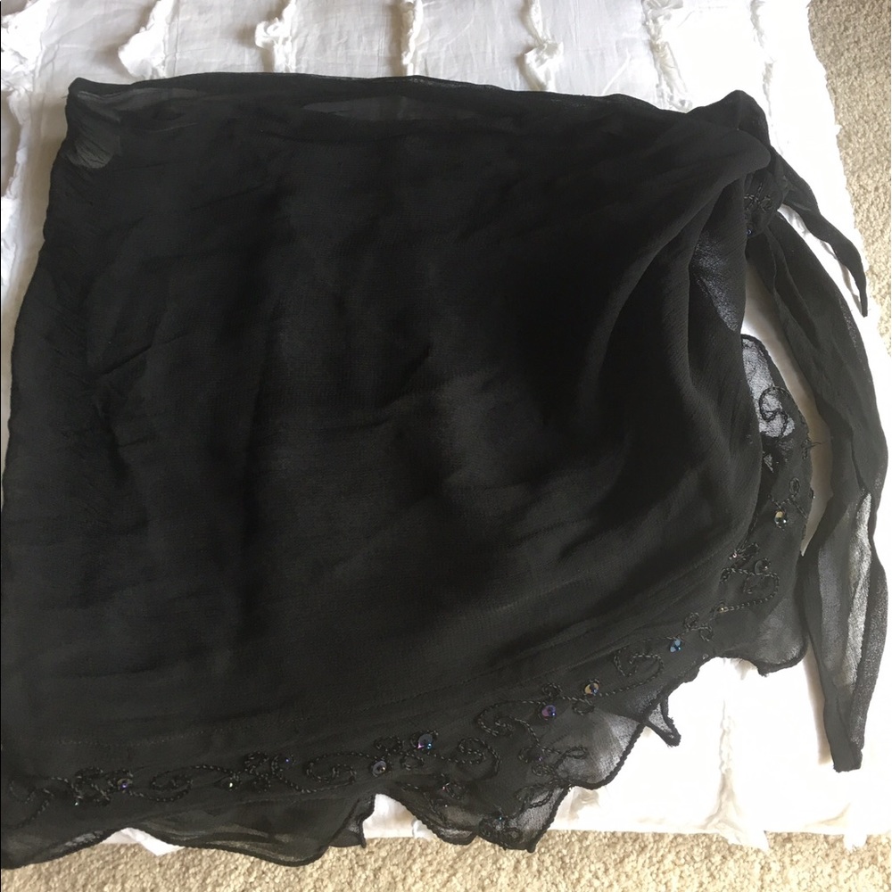 Black chiffon-like bathing suit wrap.