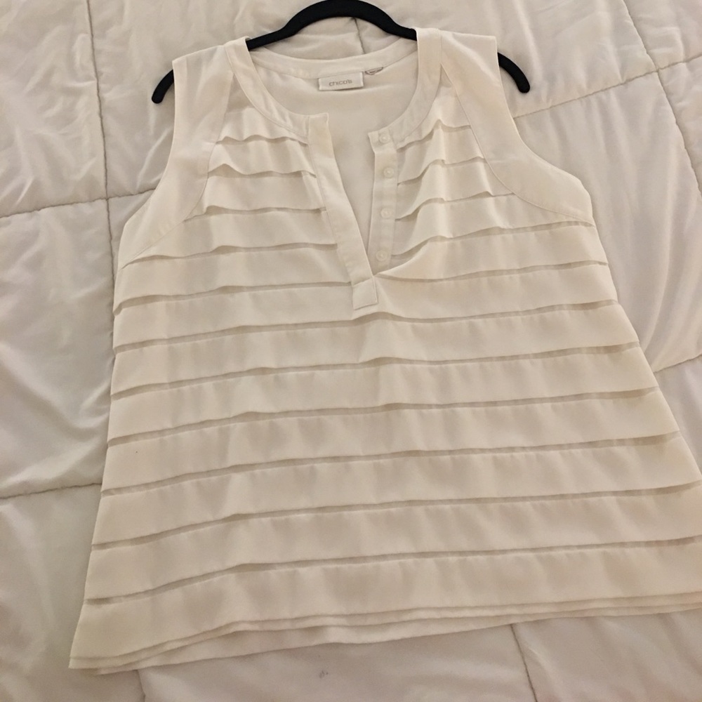 Sleeveless ivory ruffled blouse