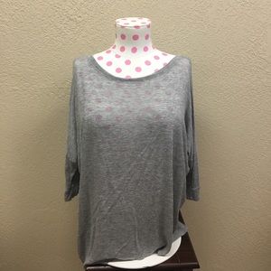 Grey three quarter sleeve loose fitting tee.