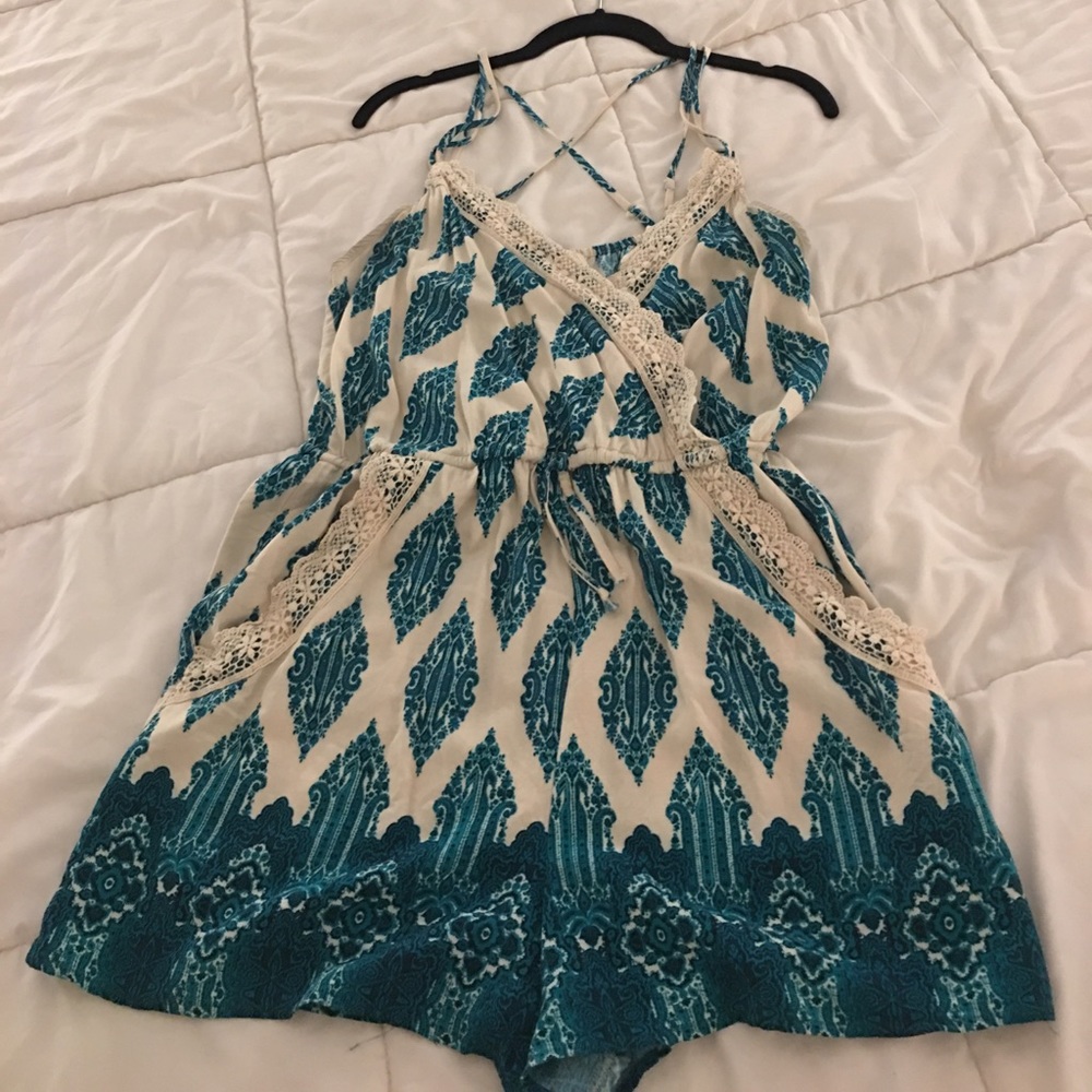 Cream spaghetti strap romper with green design