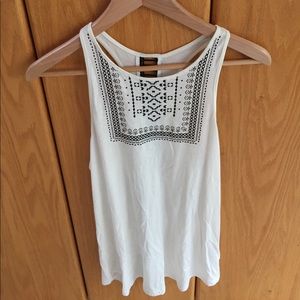 Cream white  tank top with black detailing.
