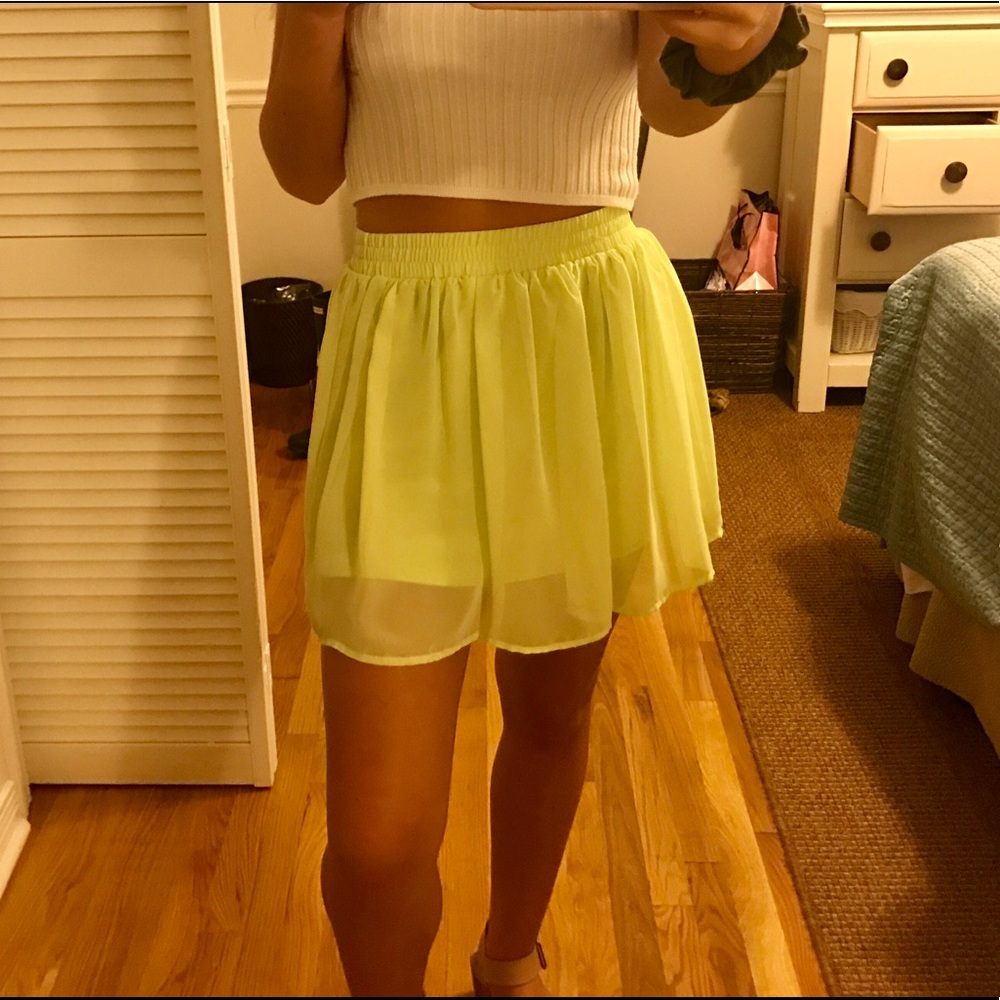 Light green flowy mini skirt.