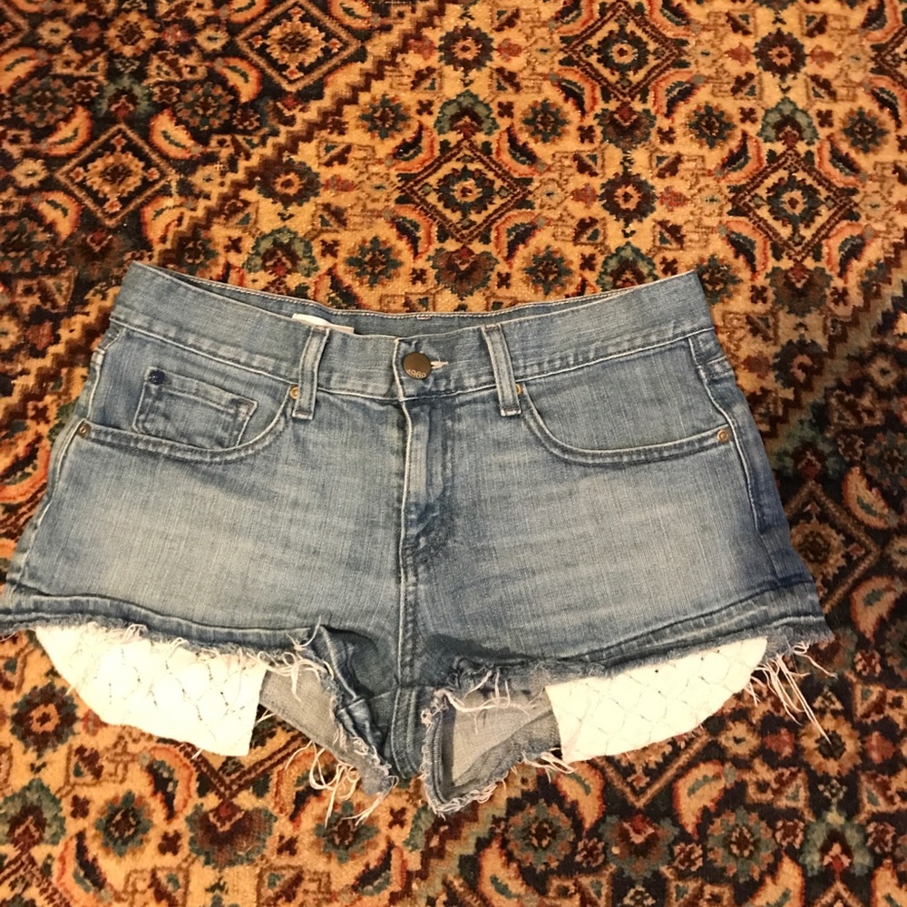 Denim shorts with lace pockets