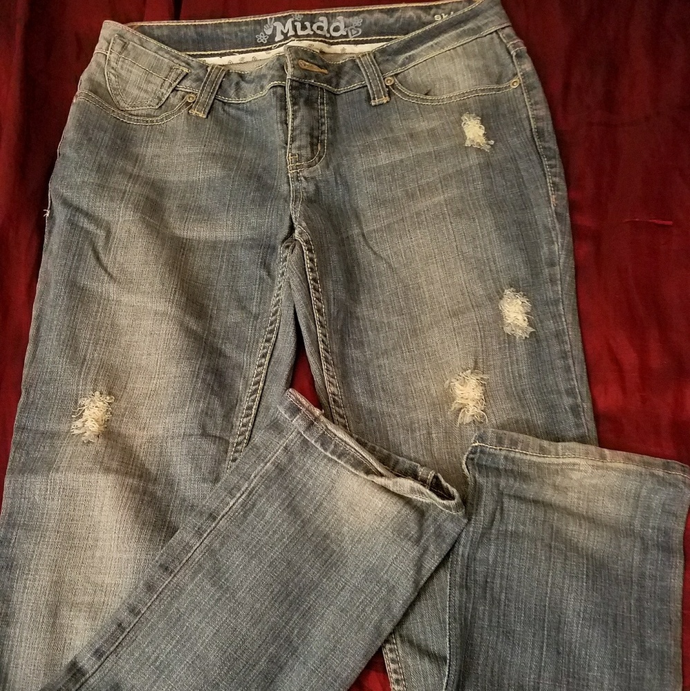 Distressed blue jeans