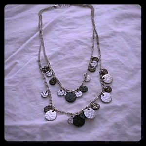 Two strand metal necklace with disk charm