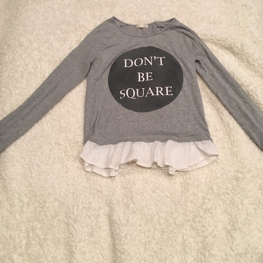 A gray long sleeve tee