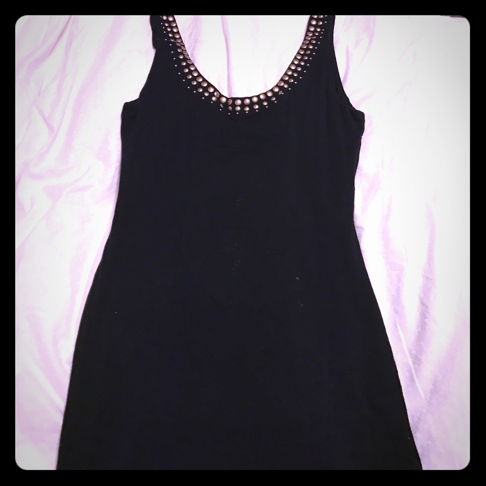 Black dress with brass embellishments