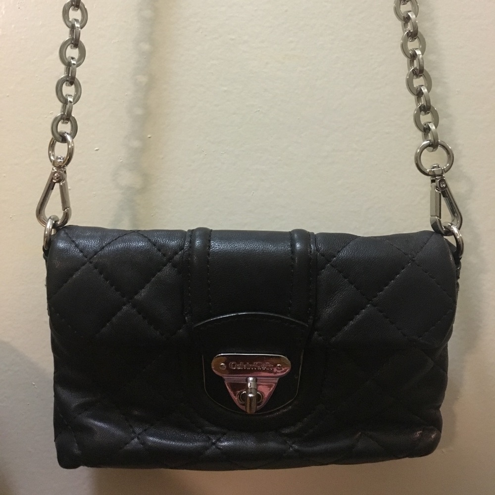 Calvin Klein black quilted cross body purse.