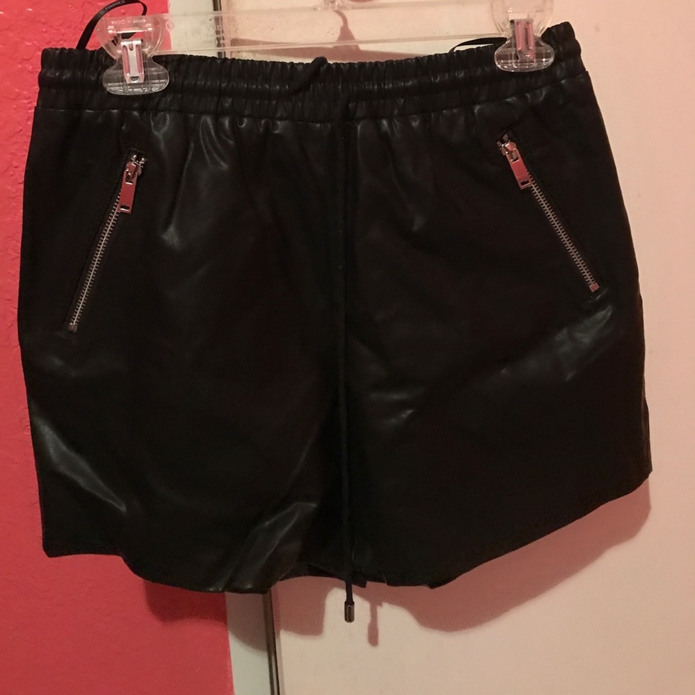 Black woven shorts.