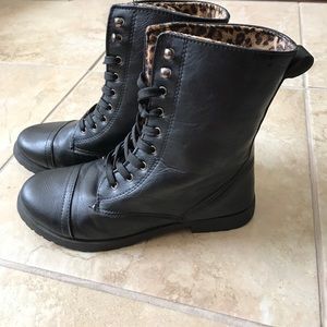 Black combat boots with cheetah interior print