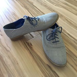 Blue and white stripped loafers.