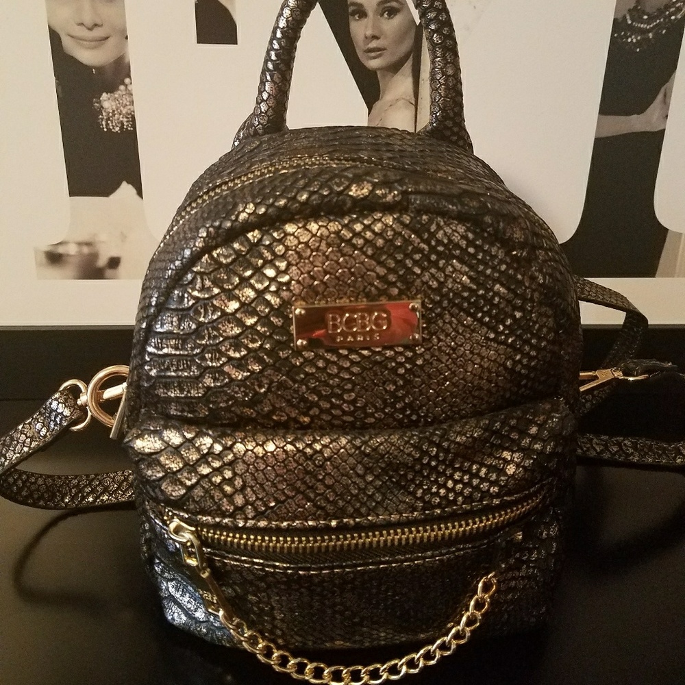 BCBG back pack style handbag.  Black and gold