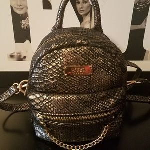 BCBG back pack style handbag.  Black and gold