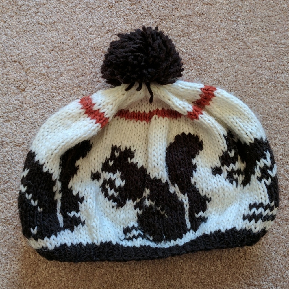 Knit hat with squirrel pattern