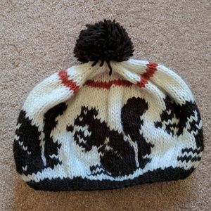 Knit hat with squirrel pattern