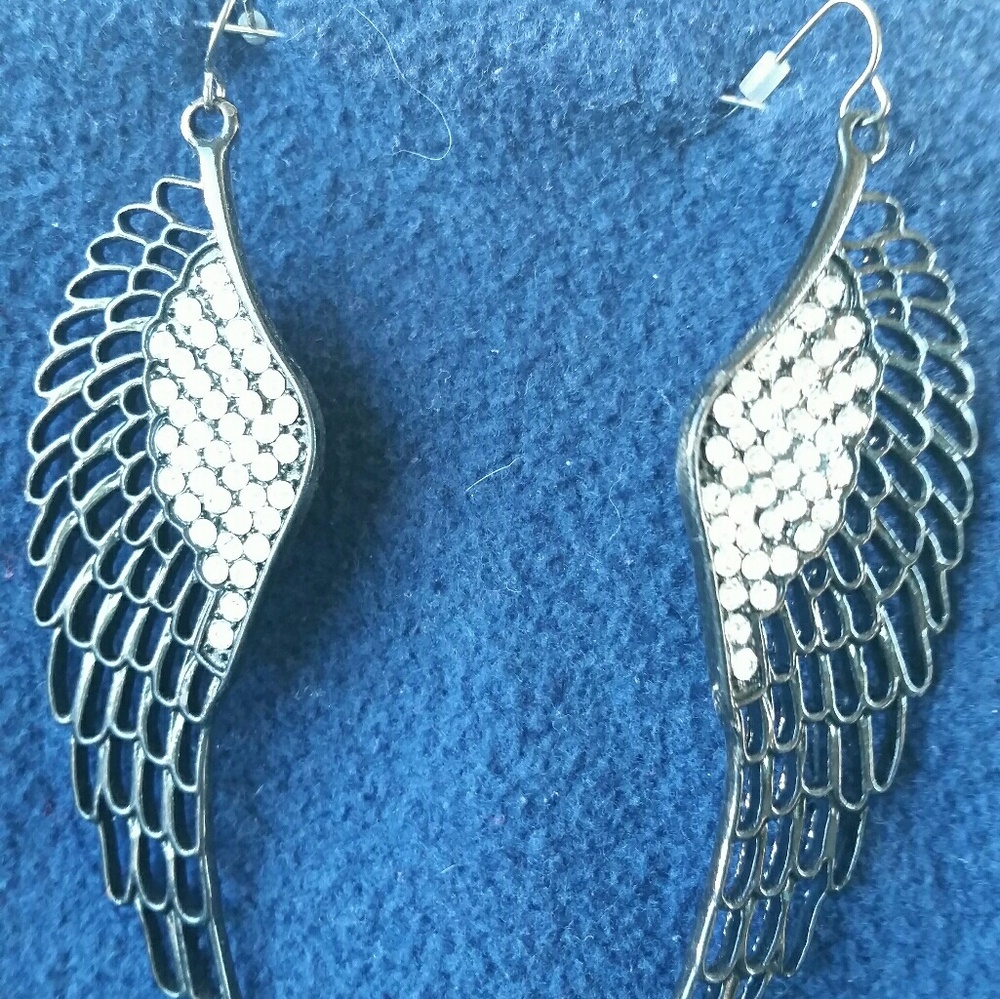 Angel wing earrings in mint condition